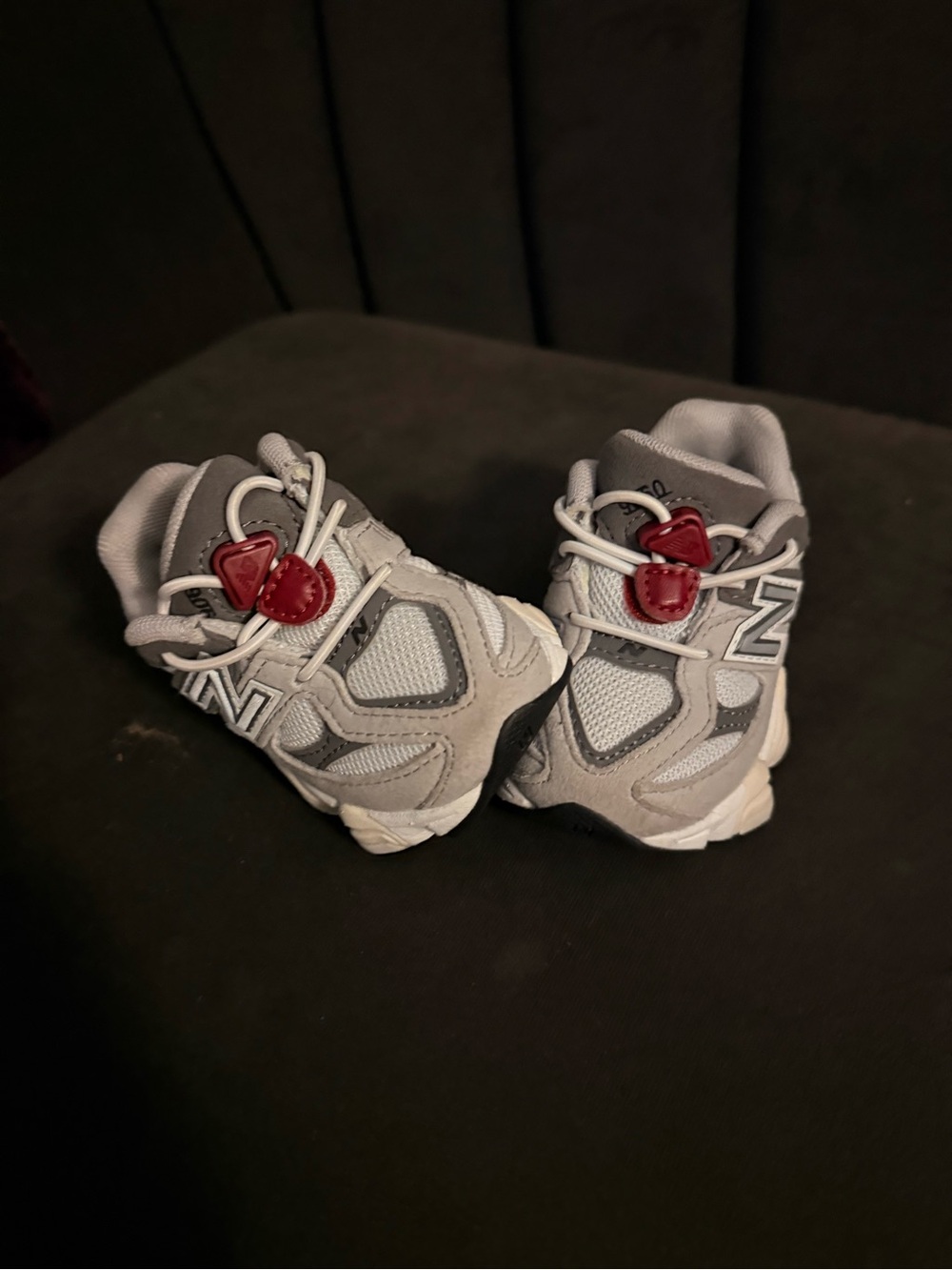 New Balance Kids Gray Sneakers with Red Toggle